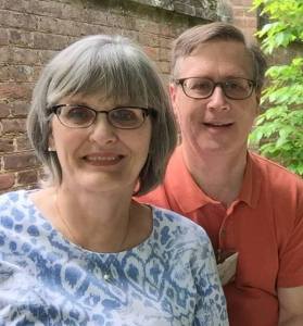 One half of this married couple is really good with numbers. The other half is sitting behind her.